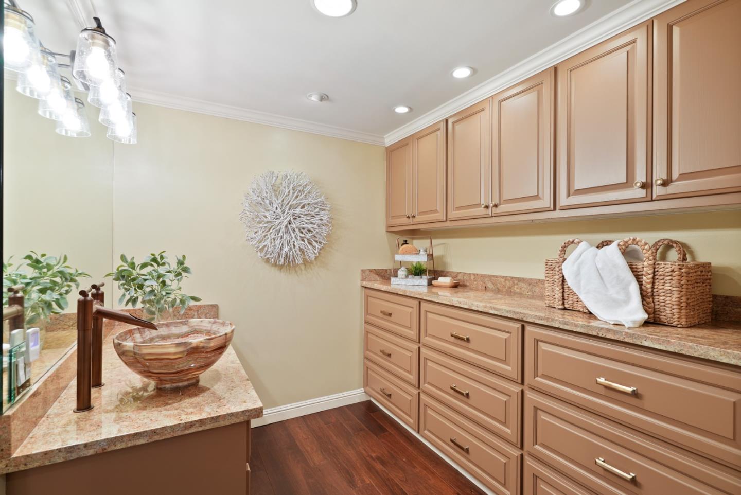 50 Mounds Road, Unit 205 San Mateo, CA 94402 - Photo 17 of 28 a kitchen with granite countertop white cabinets and window