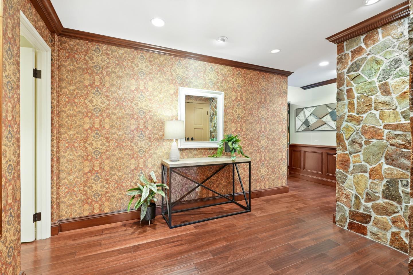 50 Mounds Road, Unit 205 San Mateo, CA 94402 - Photo 2 of 28 a view of a hallway with wooden floor and a bathroom
