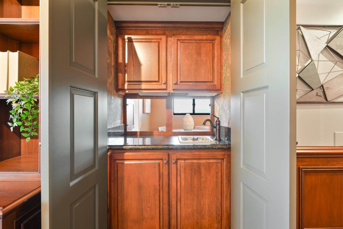 50 Mounds Road, Unit 205 San Mateo, CA 94402 - Photo 4 of 28 a kitchen with stainless steel appliances granite countertop a refrigerator a stove and a sink with wooden floor