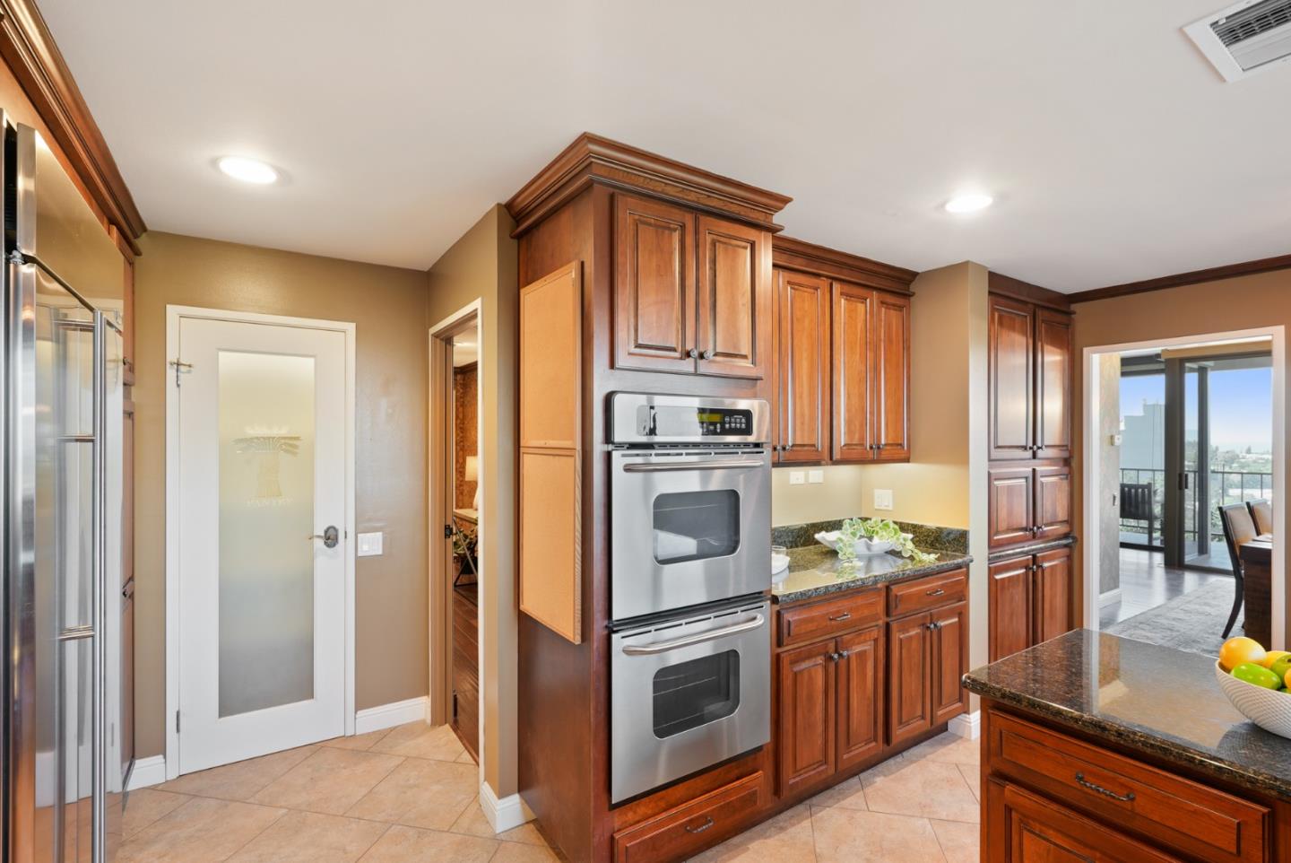 50 Mounds Road, Unit 205 San Mateo, CA 94402 - Photo 10 of 28 a kitchen with stainless steel appliances granite countertop a refrigerator a stove and a sink with large window