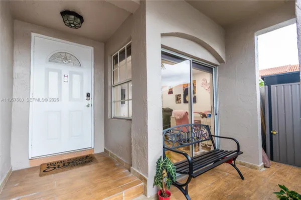 a view of a livingroom with furniture and front door