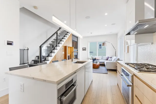 a view of living room with furniture and stove