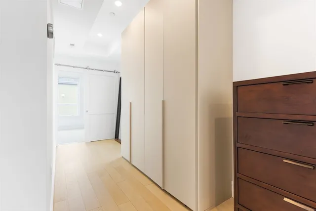 a view of a hallway with closet