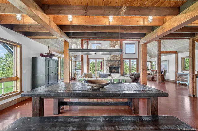 a view of living room with furniture and large windows