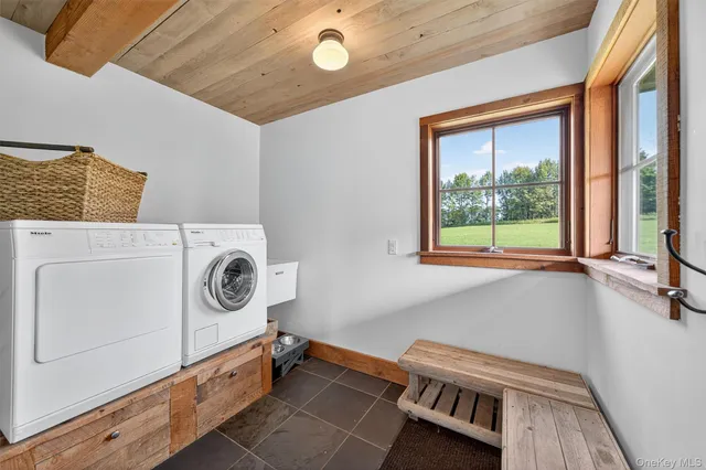 a view of storage and utility room with washer and dryer