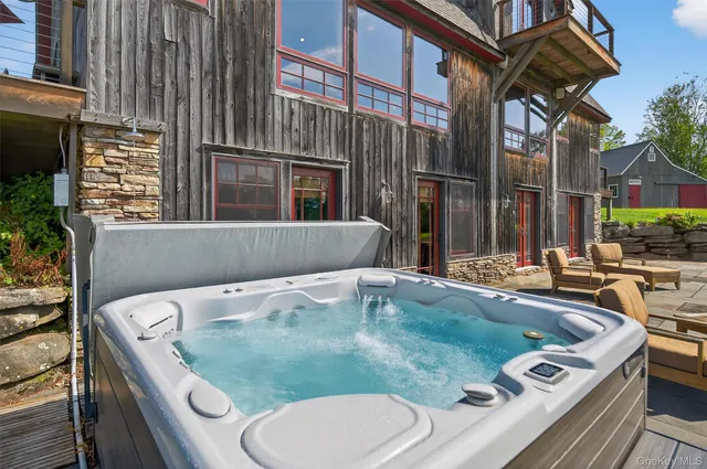 a yard with table and a chairs and plants