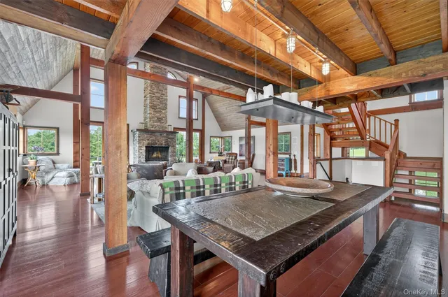 a view of a dining table chairs and wooden floor