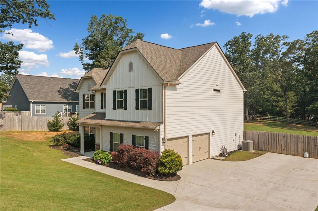 13 Four Feathers Lane Northeast Rydal, GA 30171 - Photo 4 of 51 a front view of a house with garden