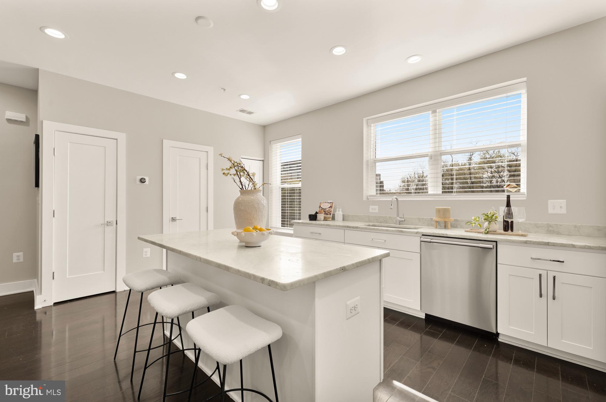 3302 9th Street Northeast, Unit 2 Washington, DC 20017 - Photo 13 of 40 a kitchen with sink and chairs