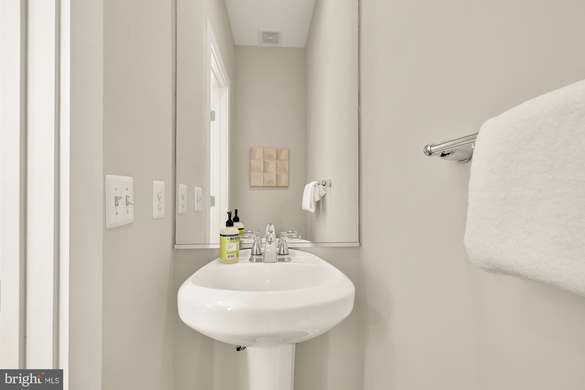 3302 9th Street Northeast, Unit 2 Washington, DC 20017 - Photo 20 of 40 a bathroom with a sink and a mirror