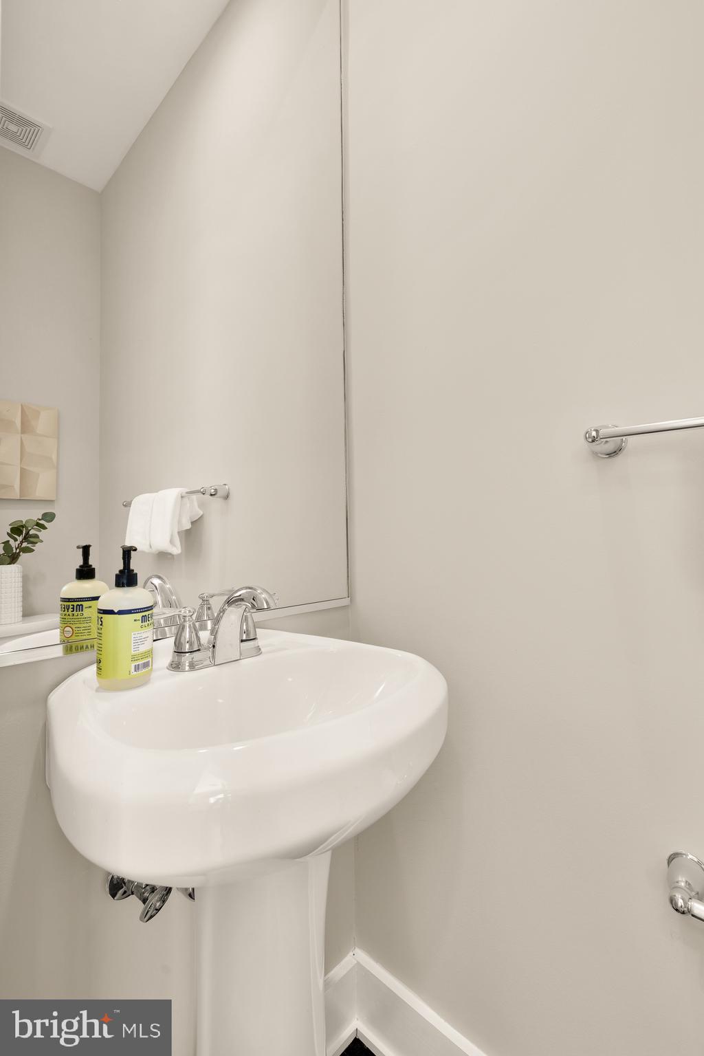 3302 9th Street Northeast, Unit 2 Washington, DC 20017 - Photo 21 of 40 a bathroom with a sink and a mirror