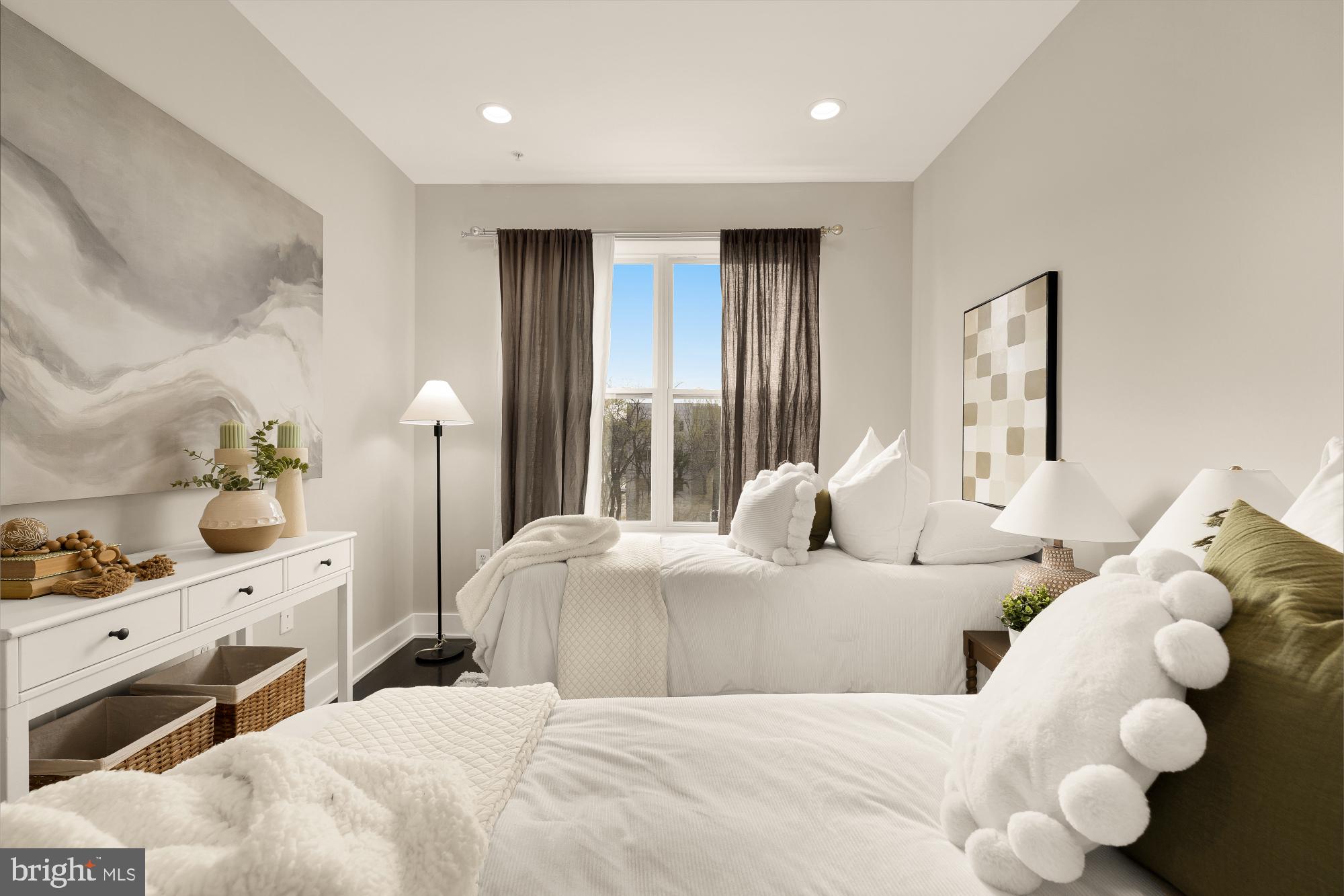 3302 9th Street Northeast, Unit 2 Washington, DC 20017 - Photo 26 of 40 a bedroom with bed and large windows