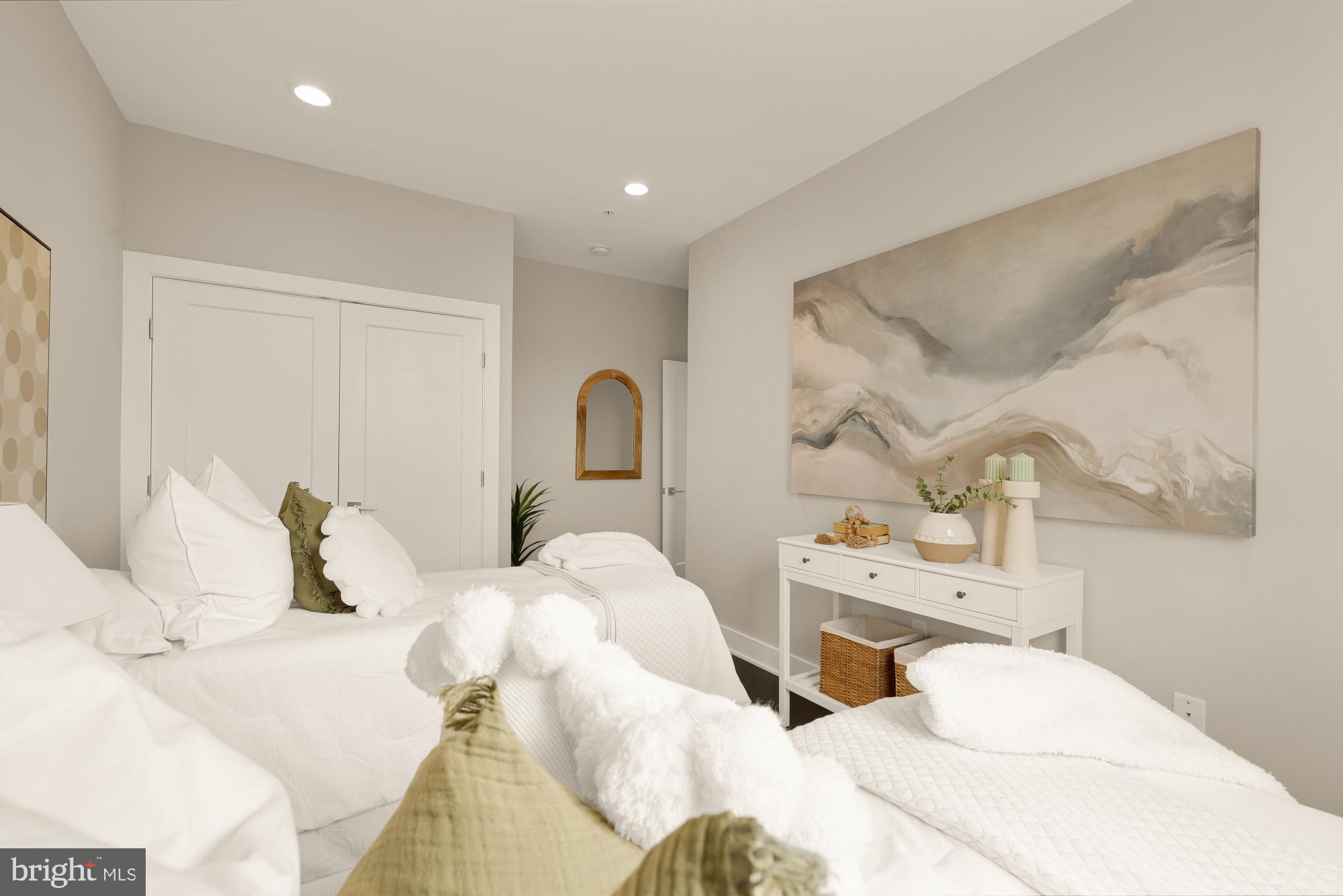 3302 9th Street Northeast, Unit 2 Washington, DC 20017 - Photo 27 of 40 a bedroom with two beds and painted walls