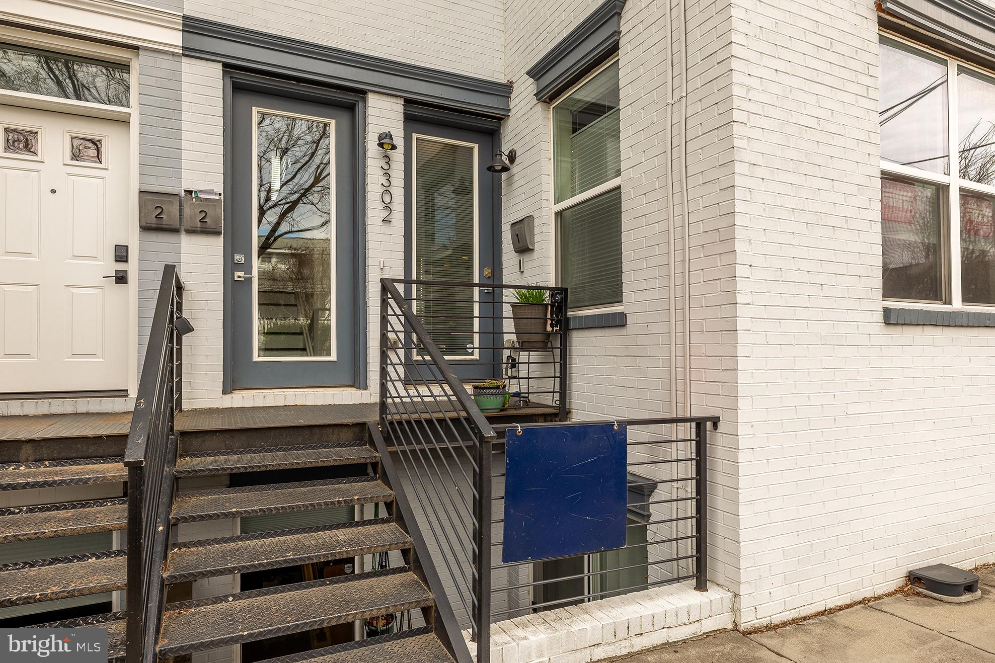 3302 9th Street Northeast, Unit 2 Washington, DC 20017 - Photo 3 of 40 a view of a house with a barbeque and wooden stairs