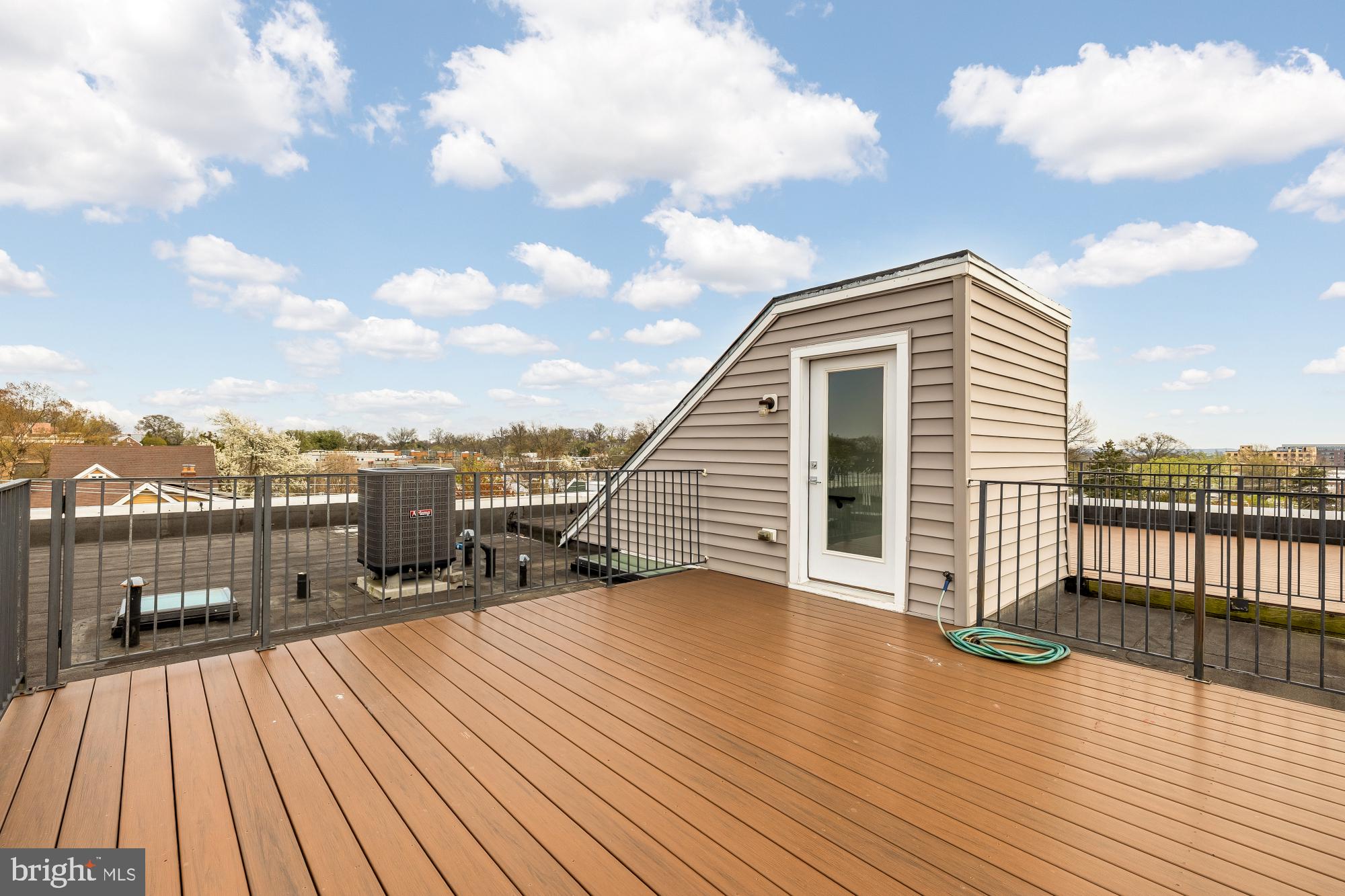 3302 9th Street Northeast, Unit 2 Washington, DC 20017 - Photo 39 of 40 a view of a balcony with wooden floor