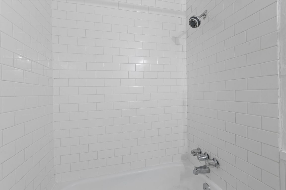 1907 Fairlawn Lane, Unit 3 Austin, TX 78704 - Photo 16 of 19 a bathroom with a bathtub