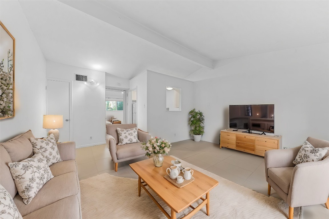 1907 Fairlawn Lane, Unit 3 Austin, TX 78704 - Photo 2 of 19 a living room with furniture and a flat screen tv