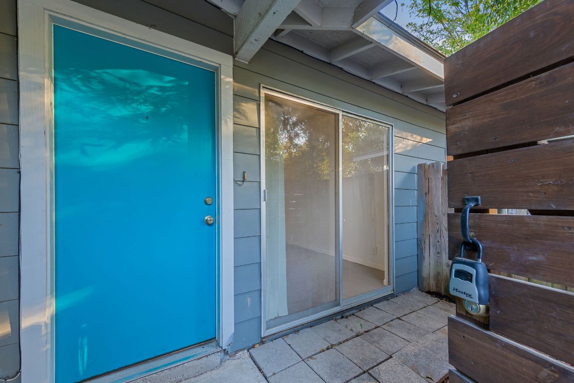 1907 Fairlawn Lane, Unit 3 Austin, TX 78704 - Photo 7 of 19 a view of a glass door and an outdoor space