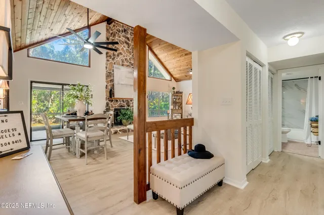 a view of living room with a fireplace and cabinets