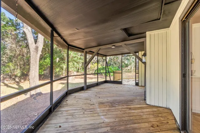 a view of hallway with wooden floor