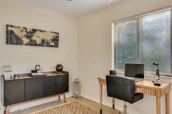 a work room with furniture and a window
