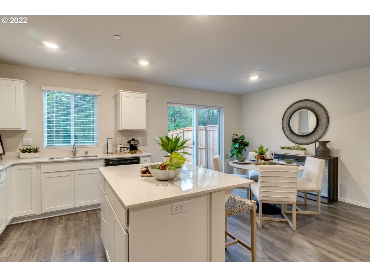 217 North 30th Drive Ridgefield, WA 98642 - Photo 9 of 38 a kitchen with a table and chairs in it