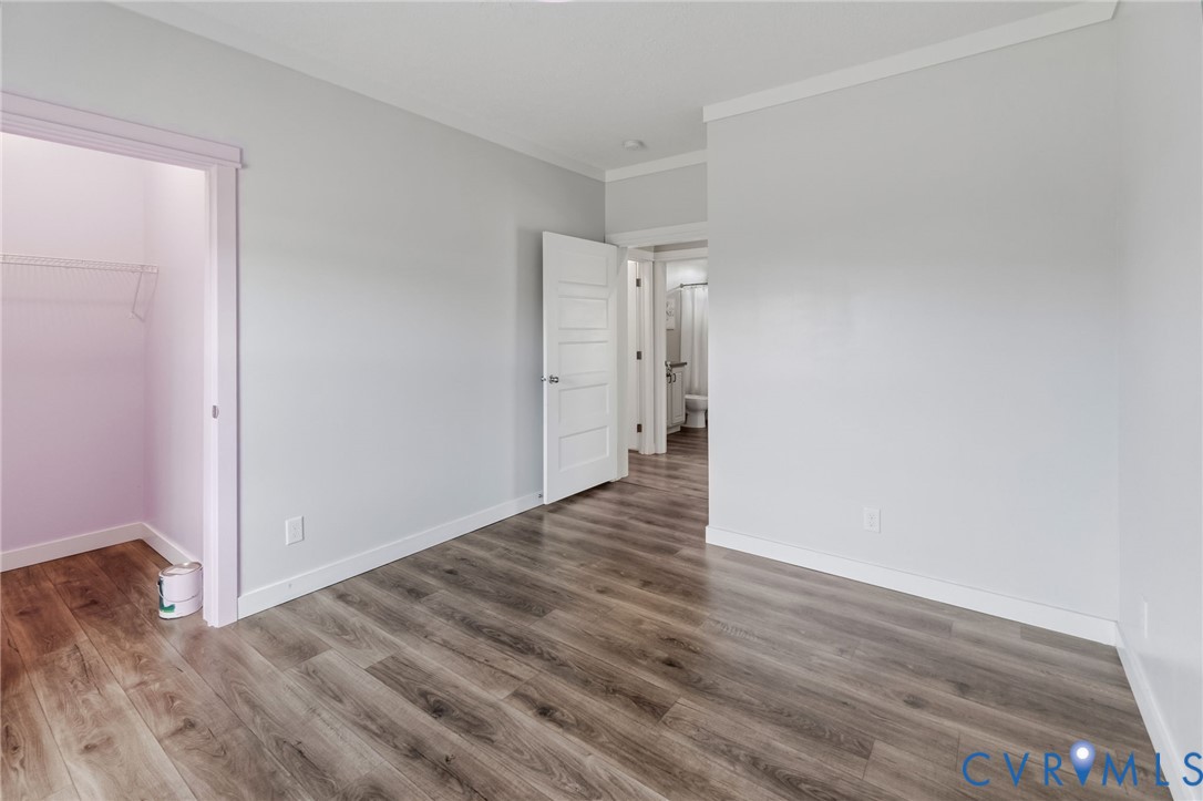 13110 Continental Road Wilsons, VA 23894 - Photo 30 of 35 Wood-finish flooring, white trim, and a white inte