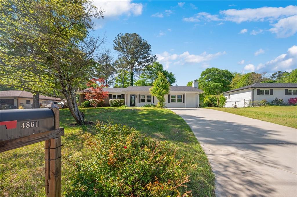 4861 Alcan Road Powder Springs, GA 30127 - Photo 1 of 1 a front view of a house with a yard