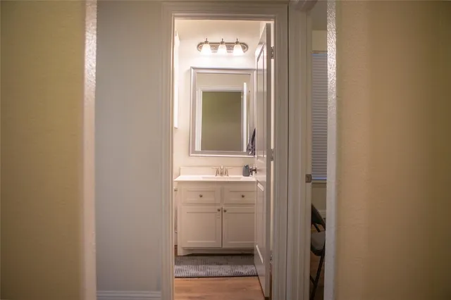 a bathroom with a sink and a mirror