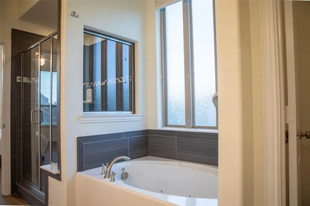 a view of a brick house with a large window