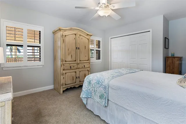 a view of a bedroom with closet and cabinet