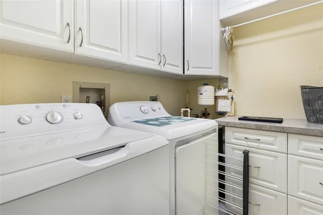 an aerial view of a residential houses with outdoor space