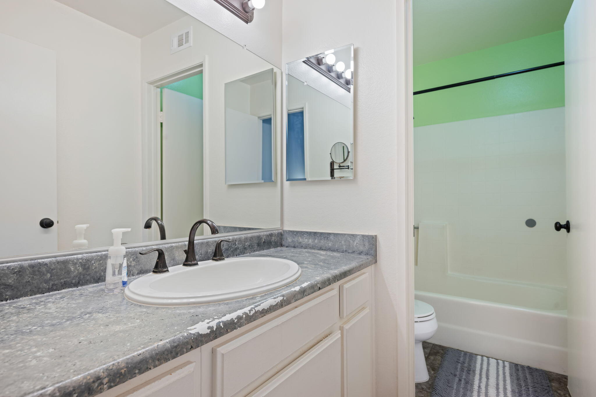 222 Ute Lane Ventura, CA 93001 - Photo 17 of 29 a bathroom with a granite countertop sink toilet and shower