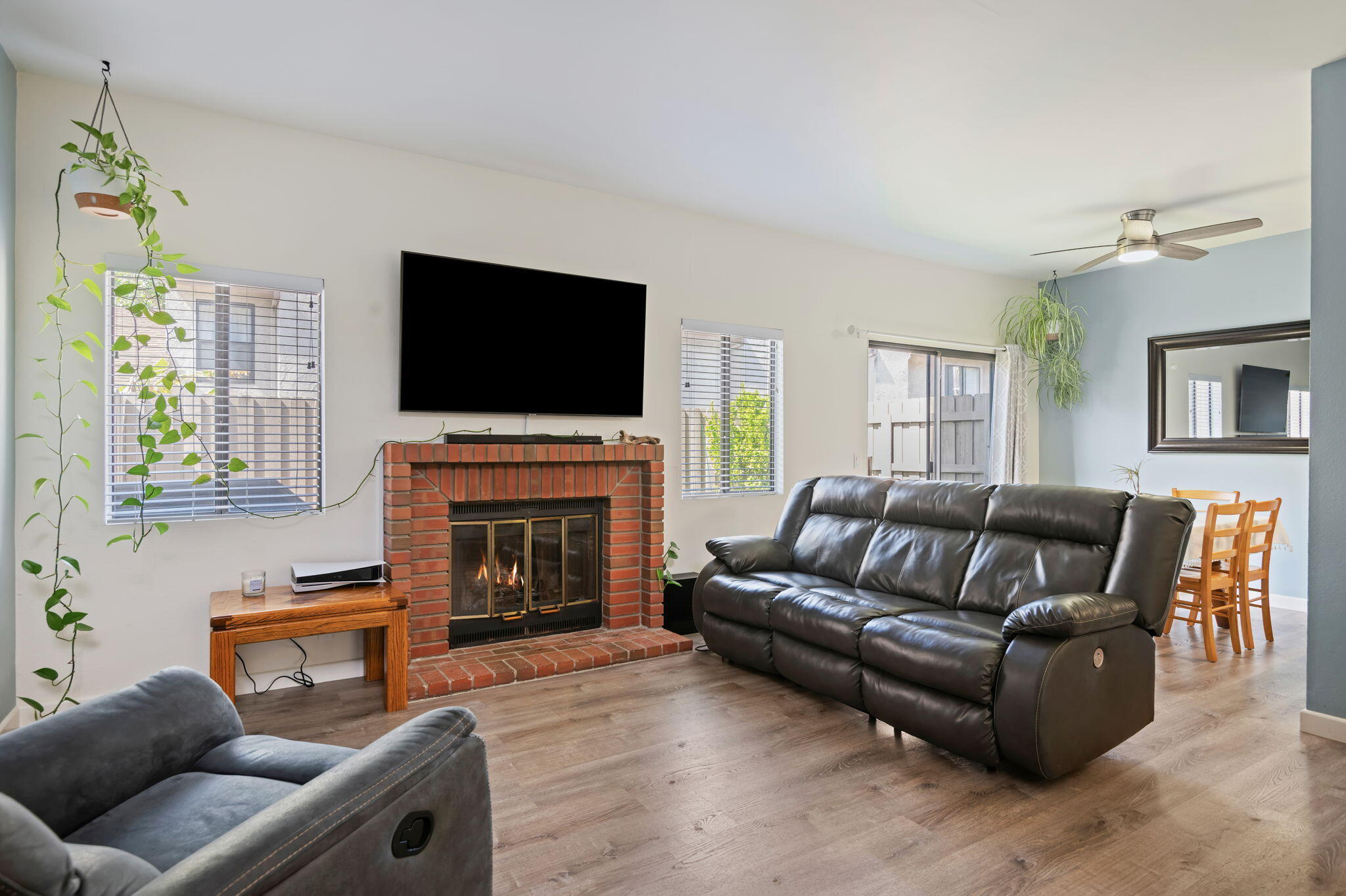222 Ute Lane Ventura, CA 93001 - Photo 3 of 29 a living room with furniture a fireplace and a flat screen tv