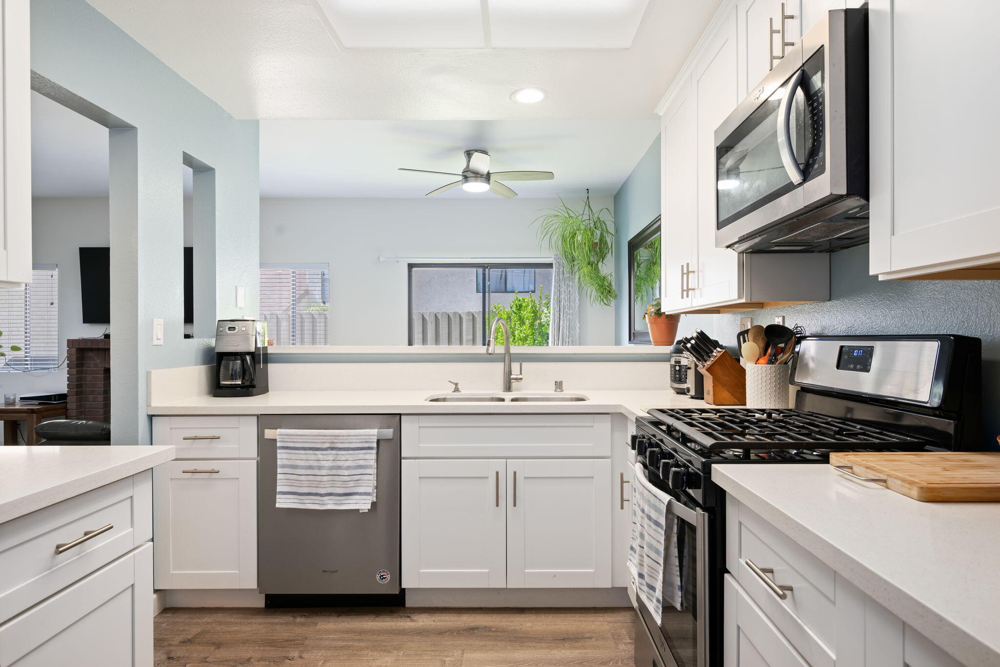 222 Ute Lane Ventura, CA 93001 - Photo 7 of 29 a kitchen with stainless steel appliances a sink stove and cabinets
