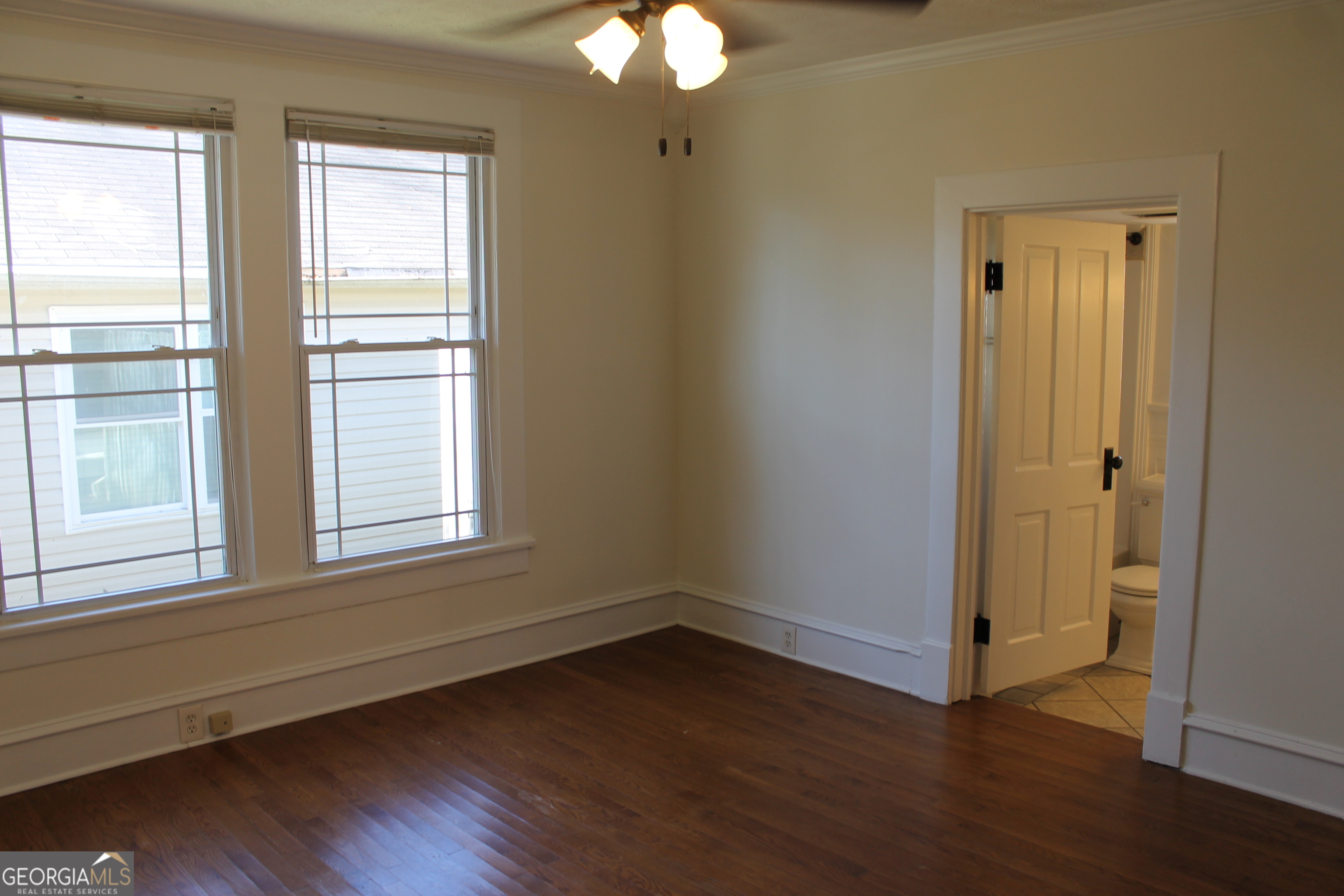 71 Clark Street Newnan, GA 30263 - Photo 11 of 19 a view of an empty room with wooden floor and a window