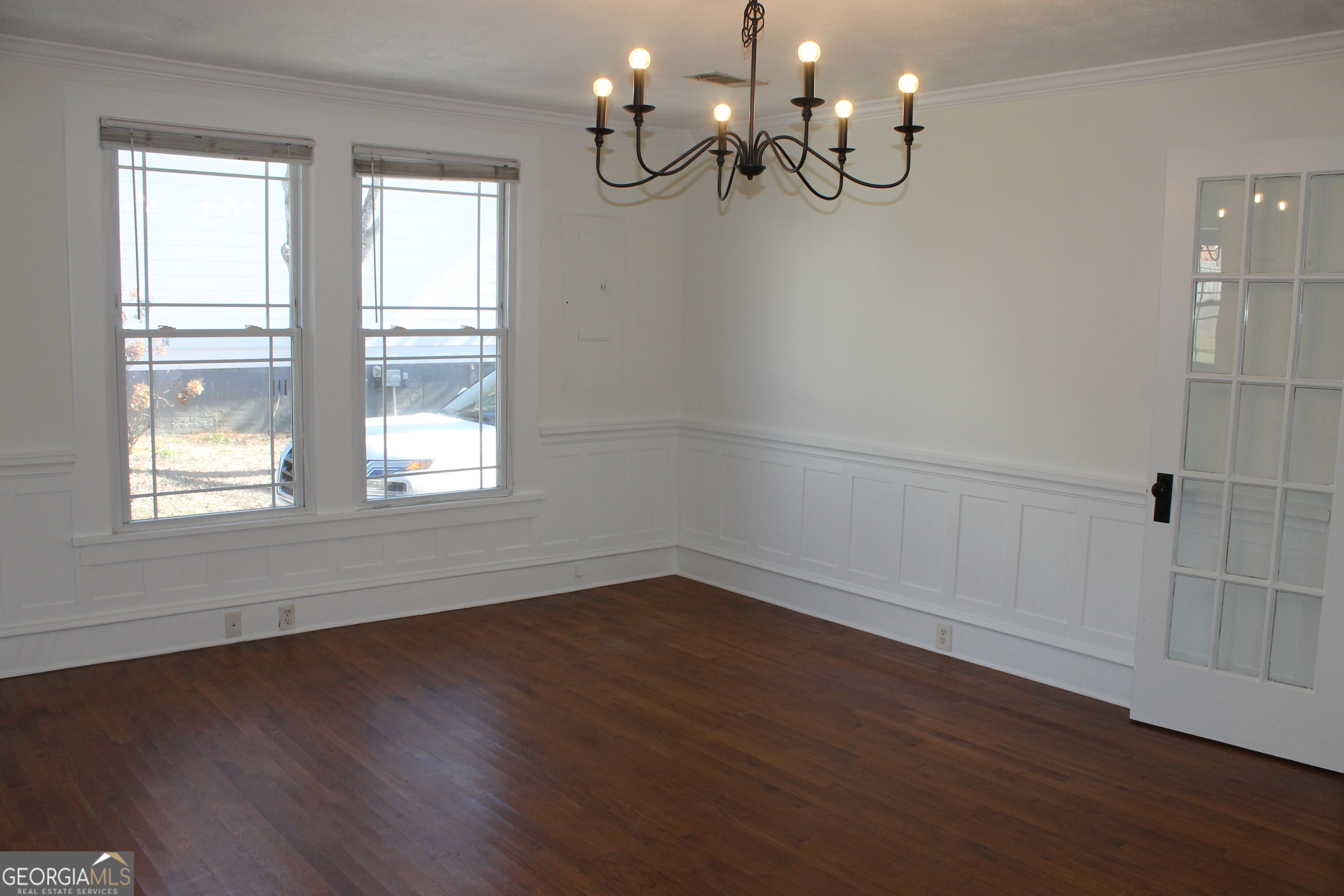 71 Clark Street Newnan, GA 30263 - Photo 14 of 19 an empty room with wooden floor and windows