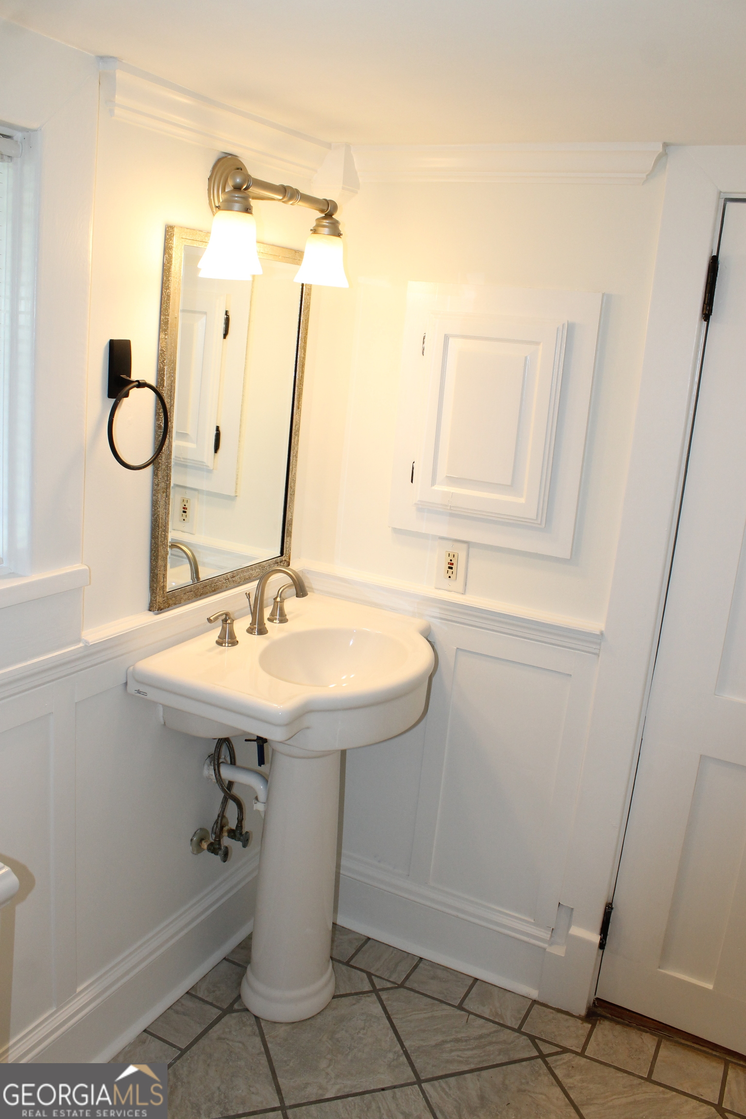 71 Clark Street Newnan, GA 30263 - Photo 15 of 19 a bathroom with a sink a mirror and vanity