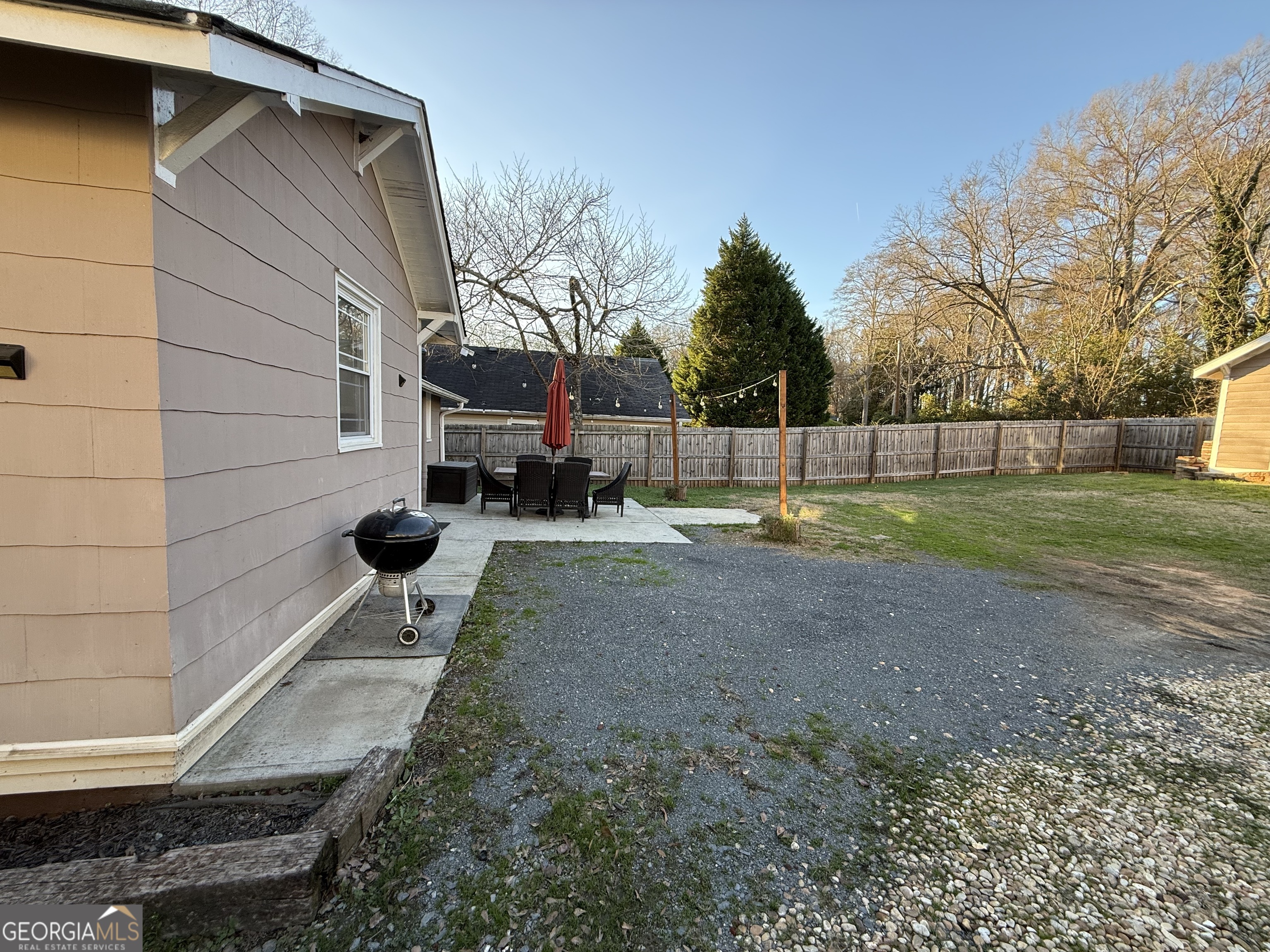 71 Clark Street Newnan, GA 30263 - Photo 19 of 19 a backyard of a house with lots of green space