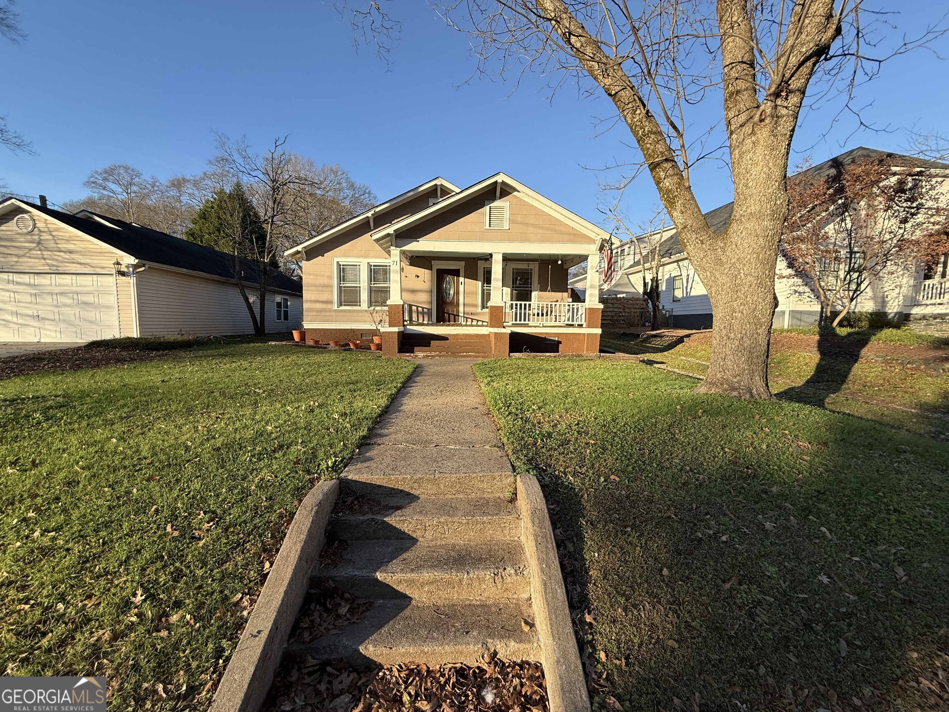 71 Clark Street Newnan, GA 30263 - Photo 3 of 19 a front view of a house with yard