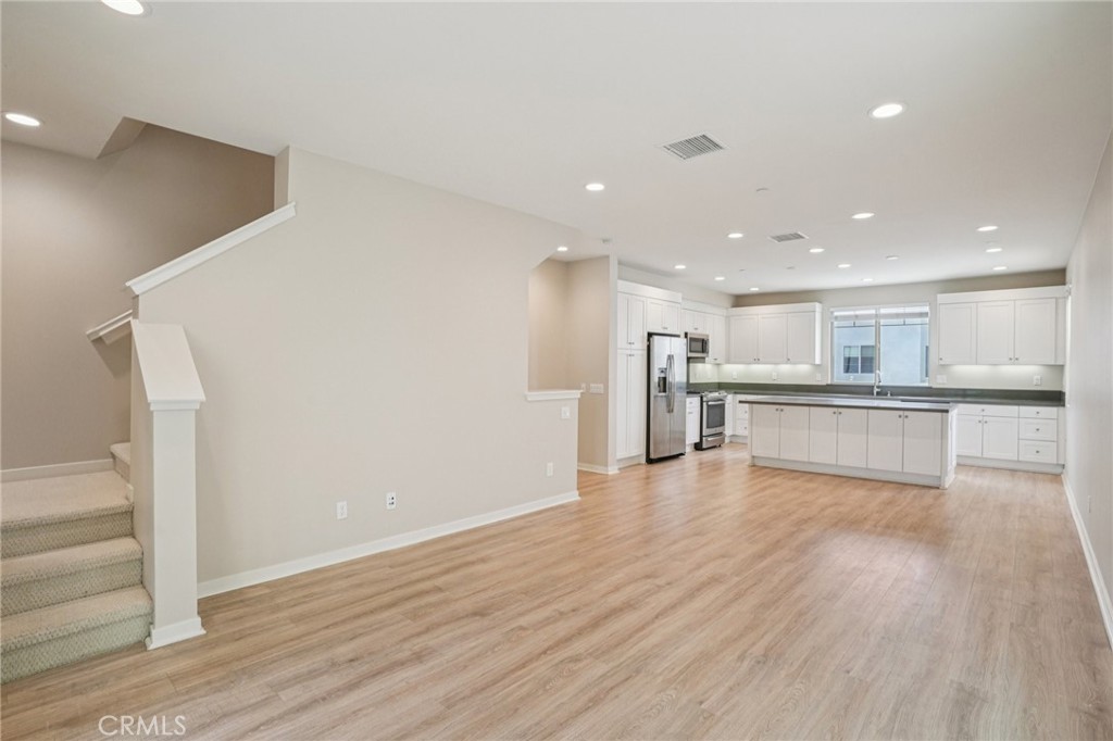 143 Frame Irvine, CA 92618 - Photo 7 of 41 a view of kitchen with wooden floor