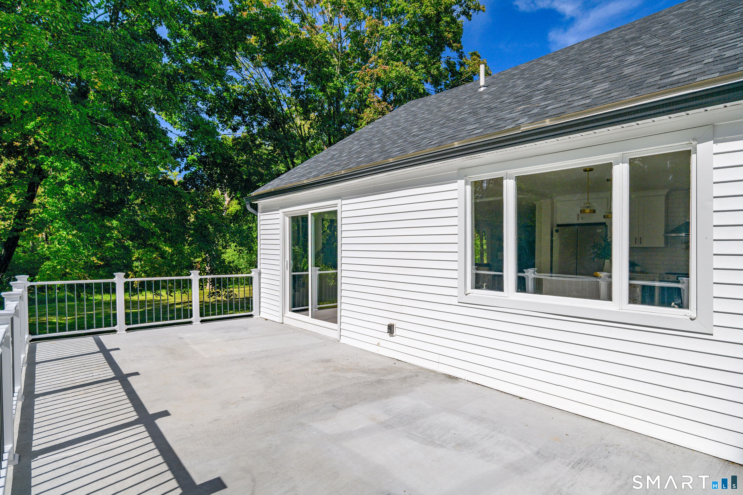 34 Rimmon Road Woodbridge, CT 06525 - Photo 32 of 40 Large outdoor deck offering plenty of room for relaxing, dining and entertaining.