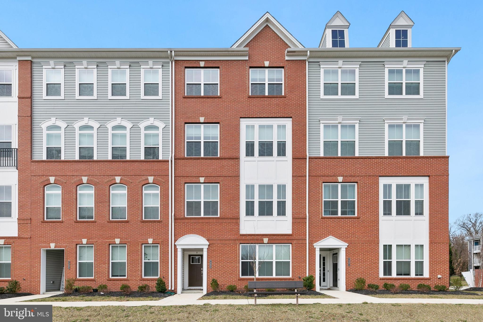 7203 Gringotts Way, Unit A Elkridge, MD 21075 - Photo 1 of 23 a front view of a building with lot of windows