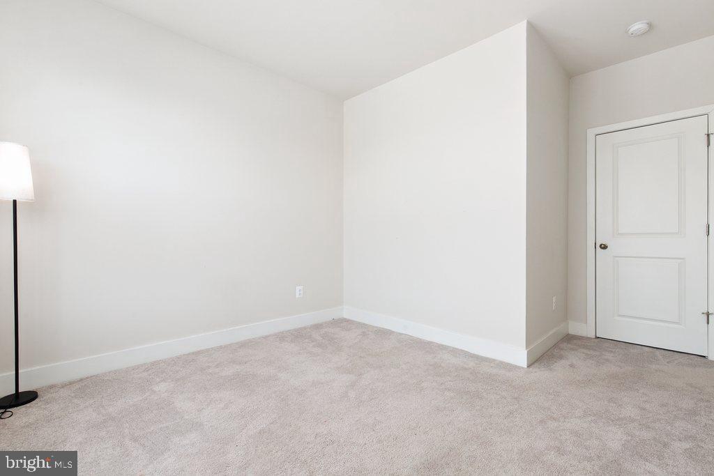7203 Gringotts Way, Unit A Elkridge, MD 21075 - Photo 16 of 23 a view of an empty room
