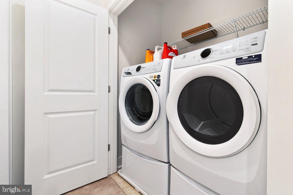7203 Gringotts Way, Unit A Elkridge, MD 21075 - Photo 17 of 23 a utility room with dryer and washer
