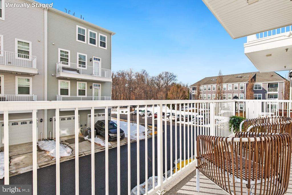 7203 Gringotts Way, Unit A Elkridge, MD 21075 - Photo 18 of 23 a view of a large building from a balcony