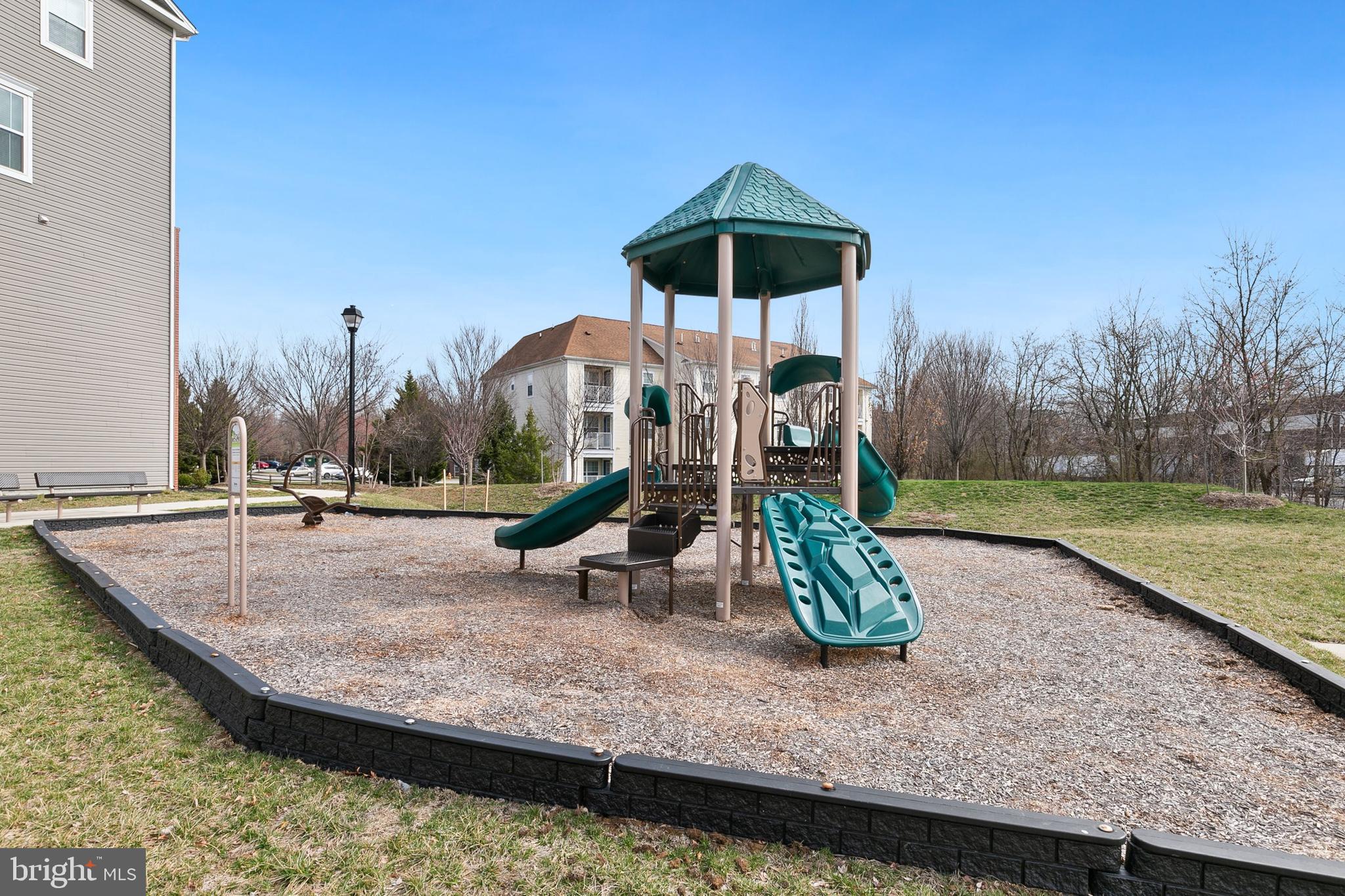 7203 Gringotts Way, Unit A Elkridge, MD 21075 - Photo 23 of 23 a view of a park with swings