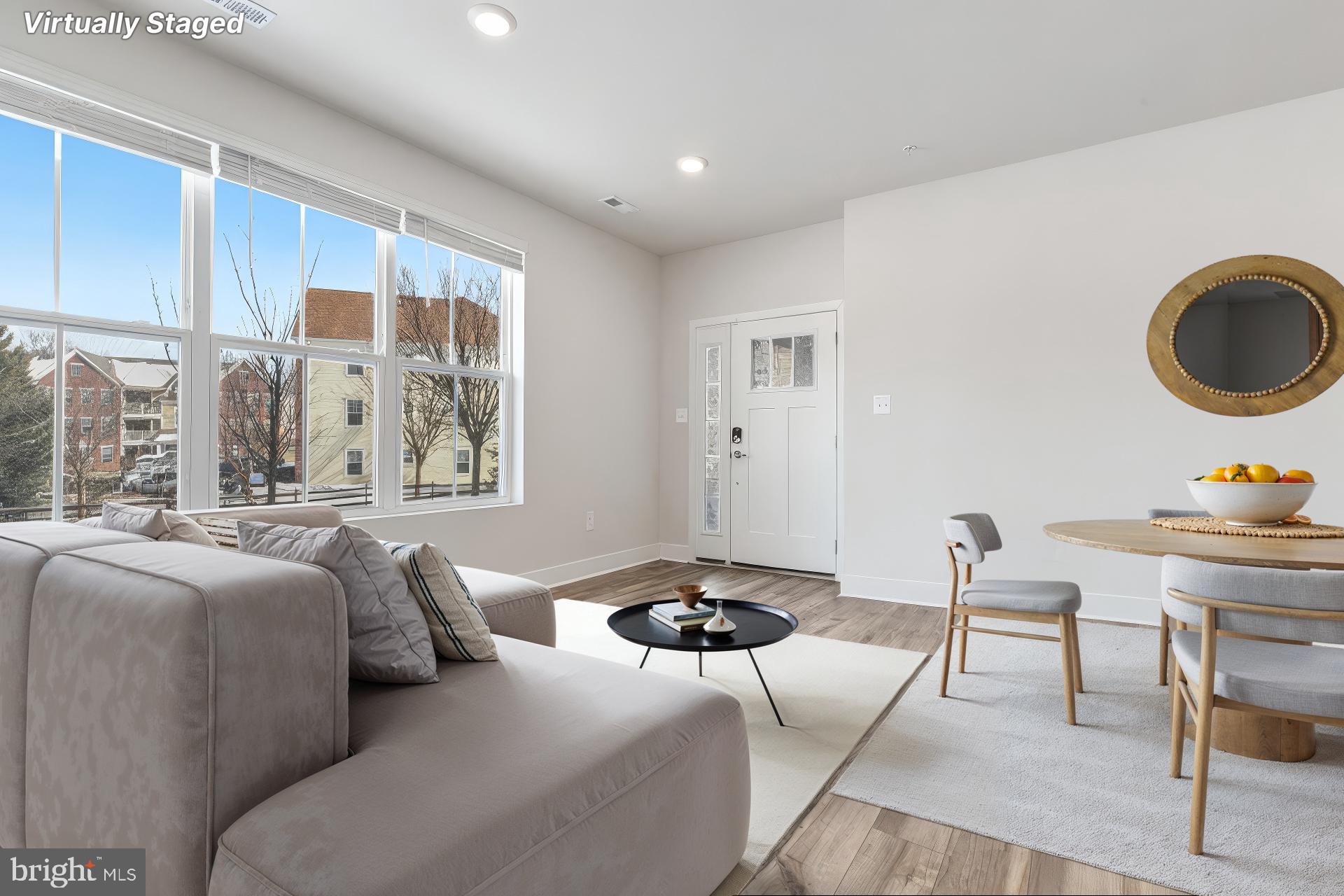 7203 Gringotts Way, Unit A Elkridge, MD 21075 - Photo 3 of 23 a living room with furniture and a window