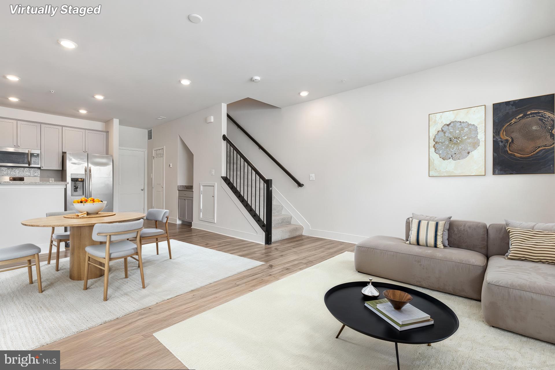 7203 Gringotts Way, Unit A Elkridge, MD 21075 - Photo 4 of 23 a living room with furniture and a breakfast area