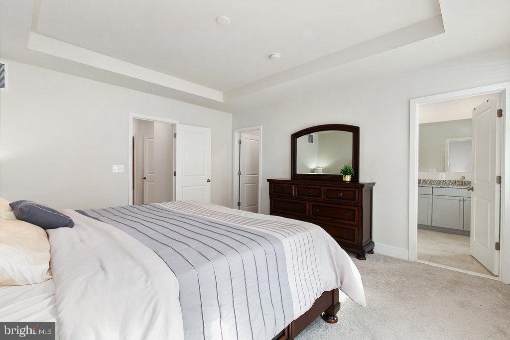 7203 Gringotts Way, Unit A Elkridge, MD 21075 - Photo 10 of 23 a bedroom with a bed and a tv